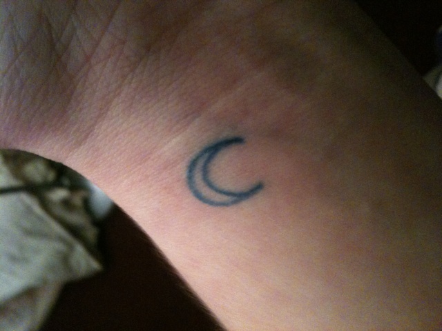The second is a blue crescent moon on my wrist